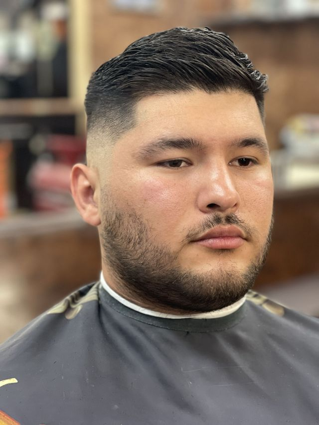 Slick back fade with full beard
