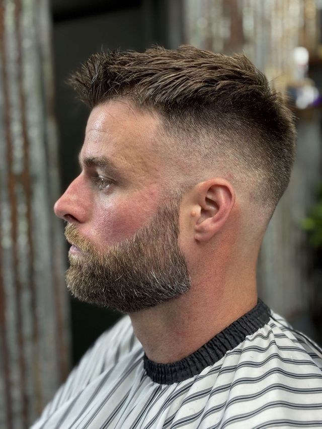 Classic high fade with textured top and beard
